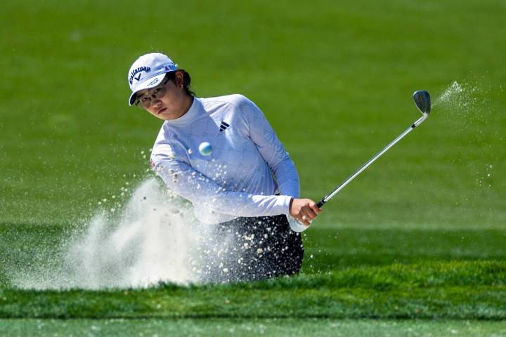 Rose Zhang digs out of a sand trap on hole #7 during the second day of the LPGA T-Mobile Match ...