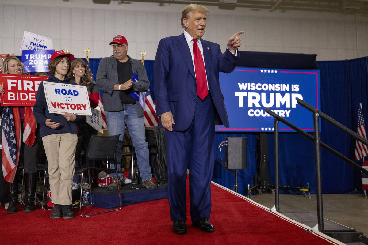 Republican presidential candidate former President Donald Trump takes the stage before speaking ...