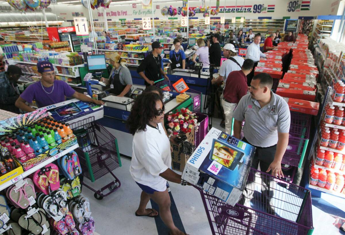 Hundreds of customers search for bargains at the grand opening of the 99 Cents Only store on Ra ...