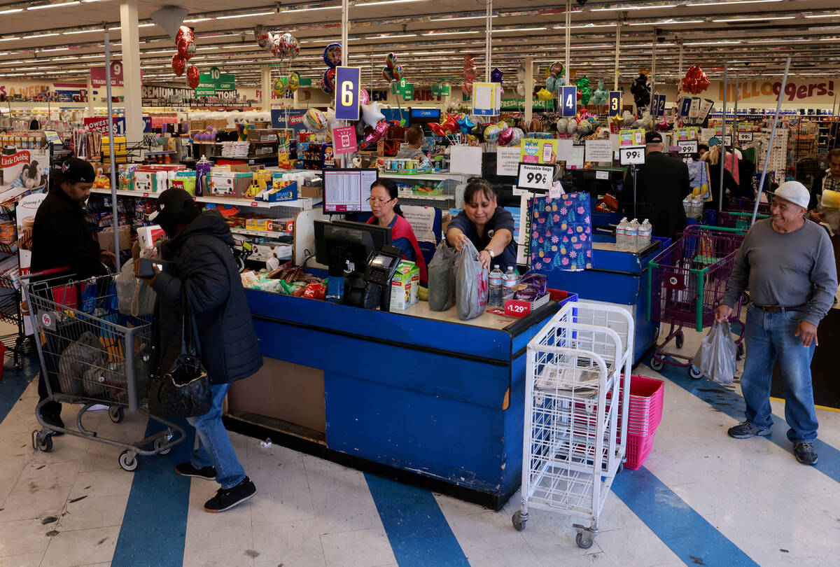 Shoppers make their purchases at the 99 Cents Only store at Flamingo Road and Maryland Parkway ...