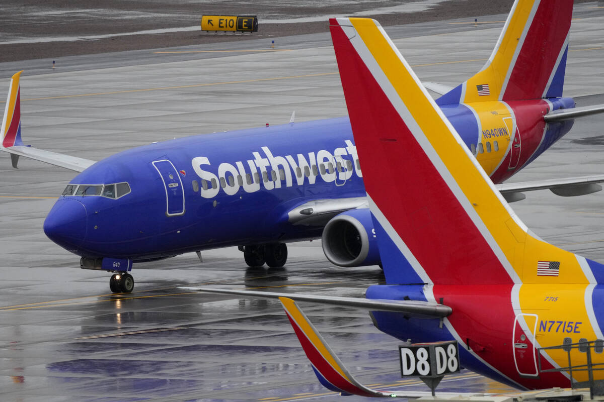 FILE - A Southwest Airlines jet arrives at Sky Harbor International Airport in Phoenix on Dec. ...