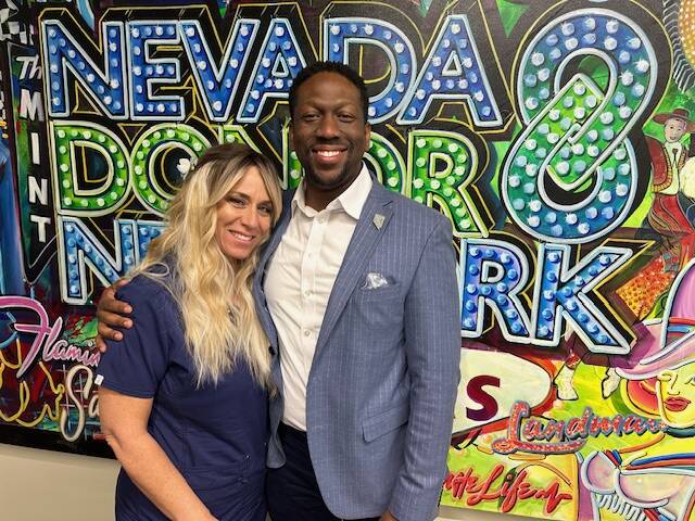 Courtney Kaplan, left, volunteer, and Tyre Gray, right, chief administrative officer of the Nev ...