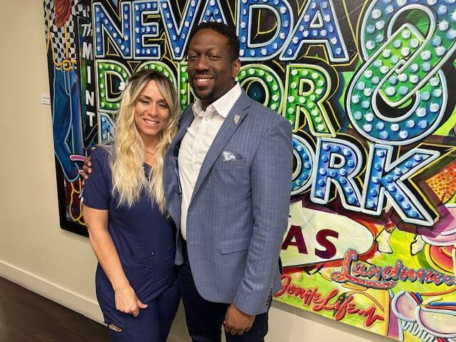 Courtney Kaplan, left, volunteer, and Tyre Gray, right, chief administrative officer of the Nev ...