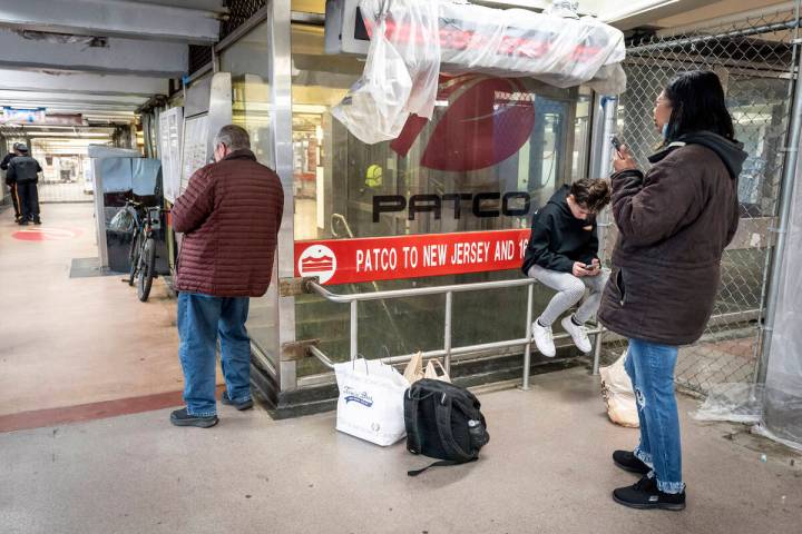 People wait at the 8th and Market PATCO station because of a suspension of service on PATCO, so ...