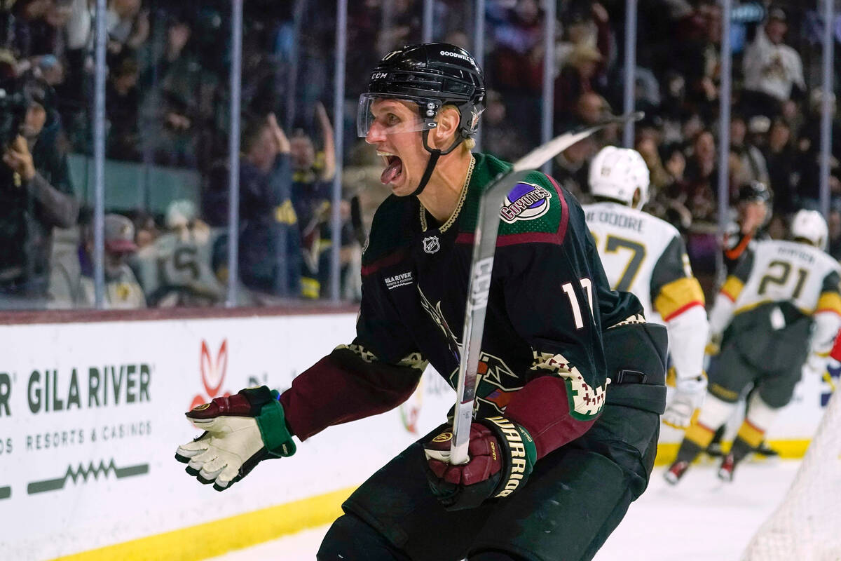 Arizona Coyotes center Nick Bjugstad (17) celebrates a goal by Josh Doanagainst the Vegas Golde ...