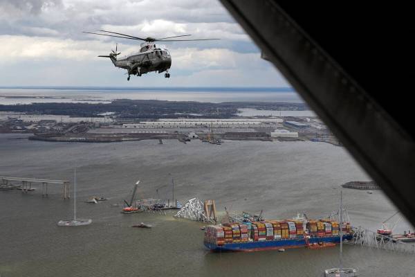 President Joe Biden, aboard Marine One, takes an aerial tour of the collapsed Francis Scott Key ...