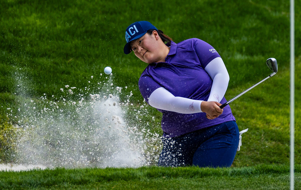 Angel Yin wedges out of a sand trap on hole #17 during the third day of the LPGA T-Mobile Match ...