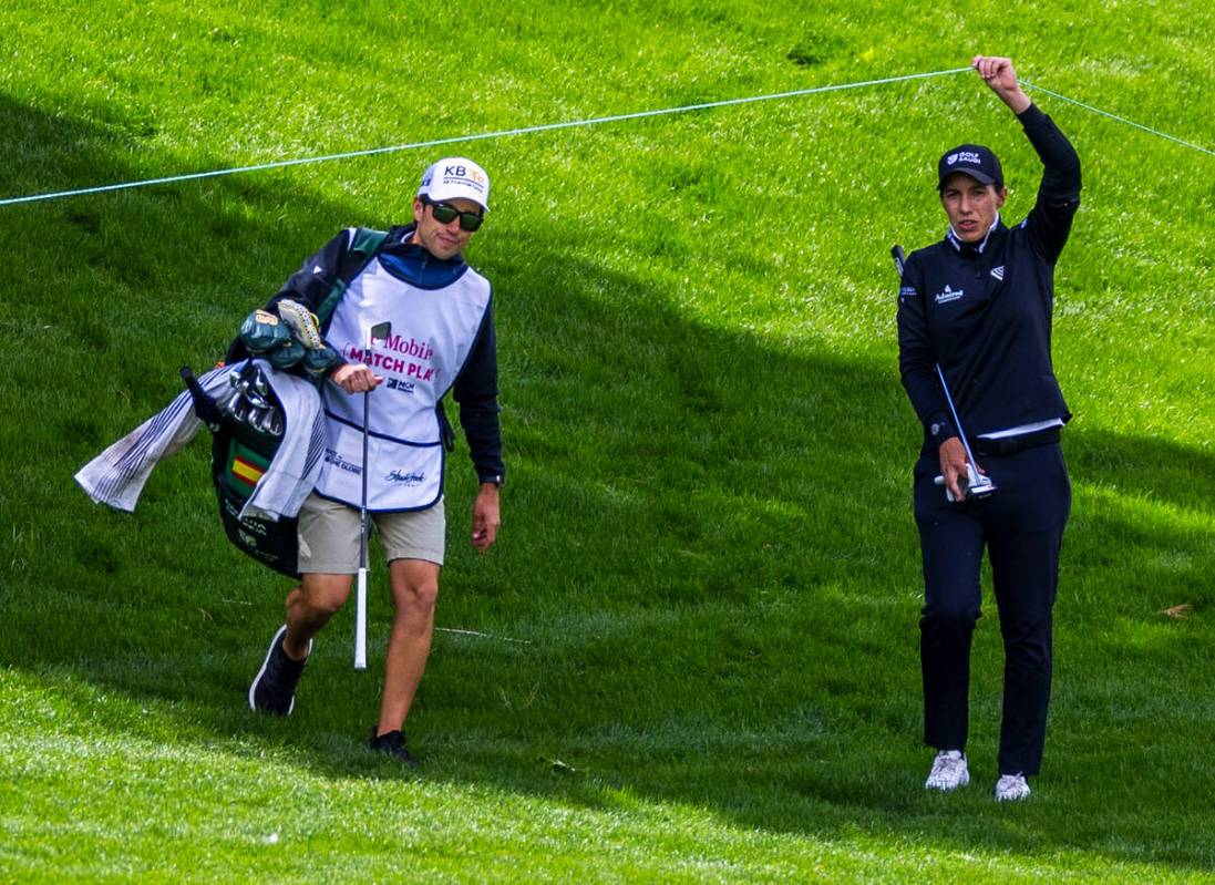 Carlota Ciganda assists her caddie Alvaro Prada under a rope line on hole #4 during the third d ...