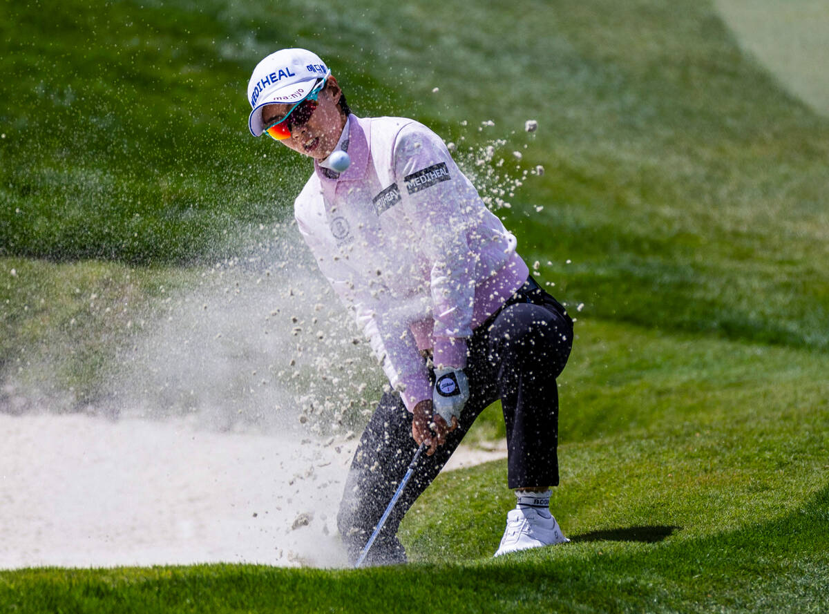 Narin An watches the ball wedged out of a sand trap on hole 4 during the third day of the LPGA ...