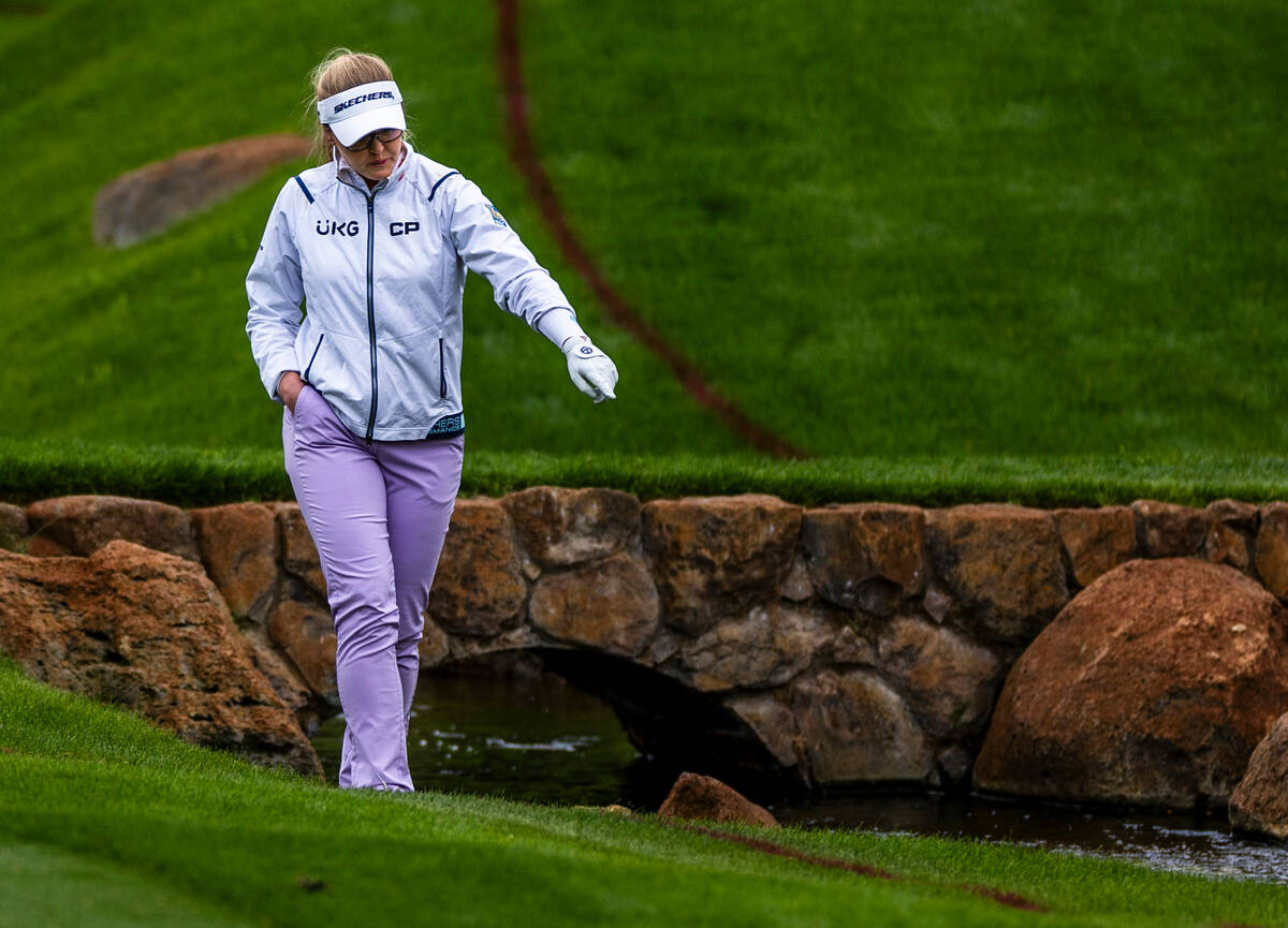 Brooke Henderson points to her ball in the water at hole #15 during the third day of the LPGA T ...