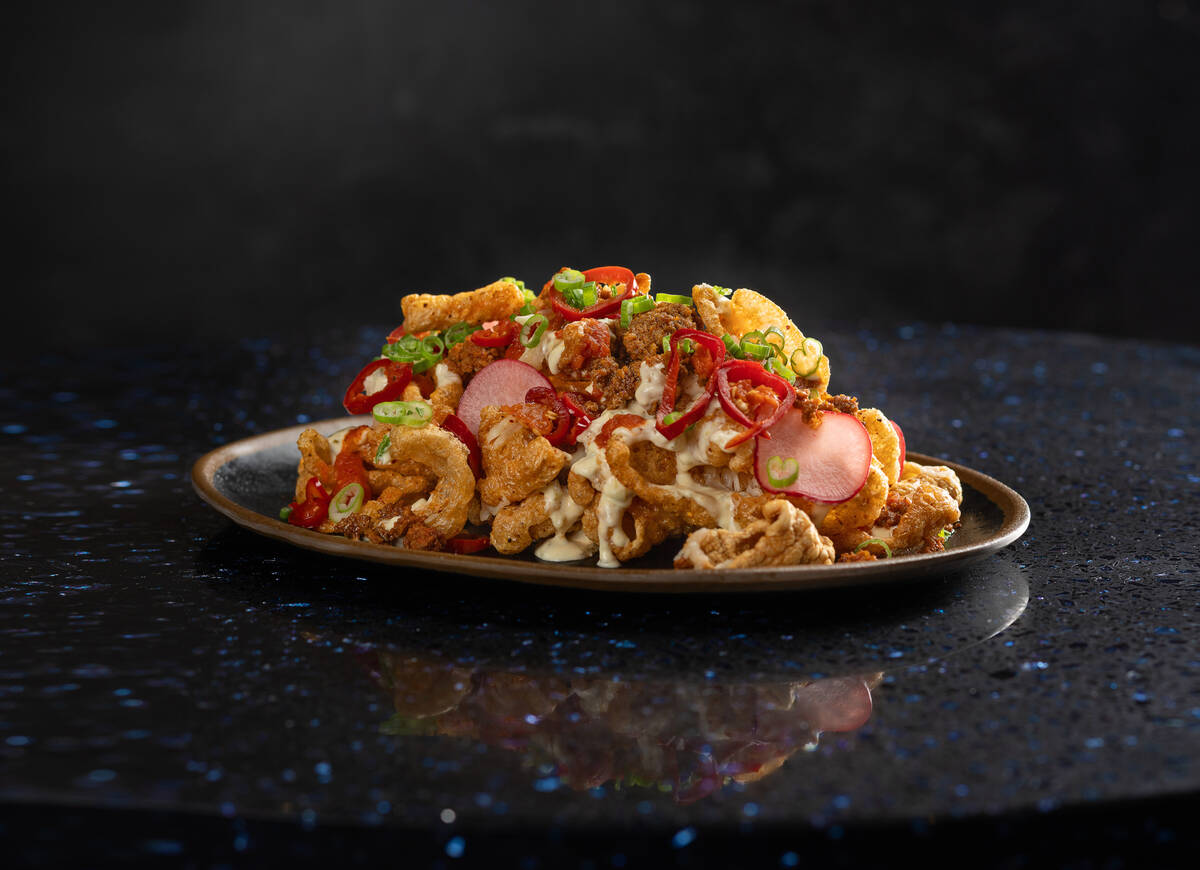 Chicharrón nachos are on the debut menu at Atomic Golf, which opened in March 2024 in downtown ...