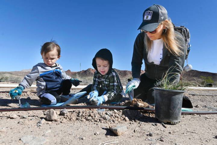 From left, Wes Salinas, Brayden Salinas, and their grandmother Tracey Waller take part in the L ...