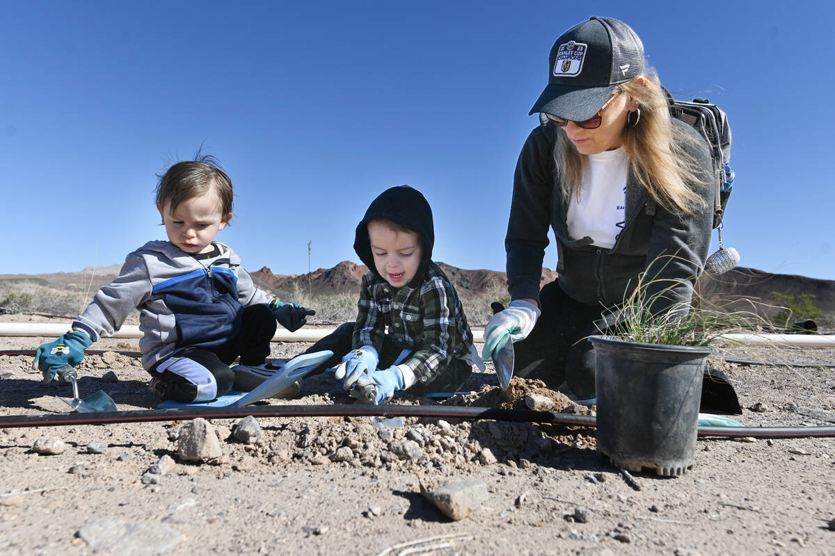 From left, Wes Salinas, Brayden Salinas, and their grandmother Tracey Waller take part in the L ...