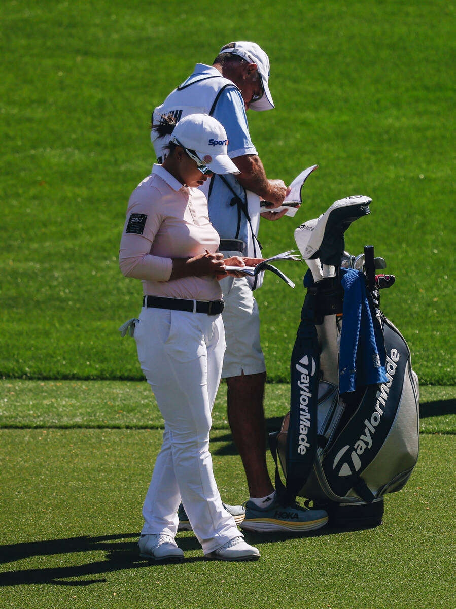 Sei Young Kim writes in her yardage book during the T-Mobile Match Play semifinals at Shadow Cr ...