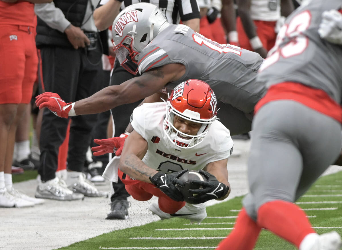UNLV wide receiver Timothy Conerly dives for extra yards during UNLV football’s Spring S ...