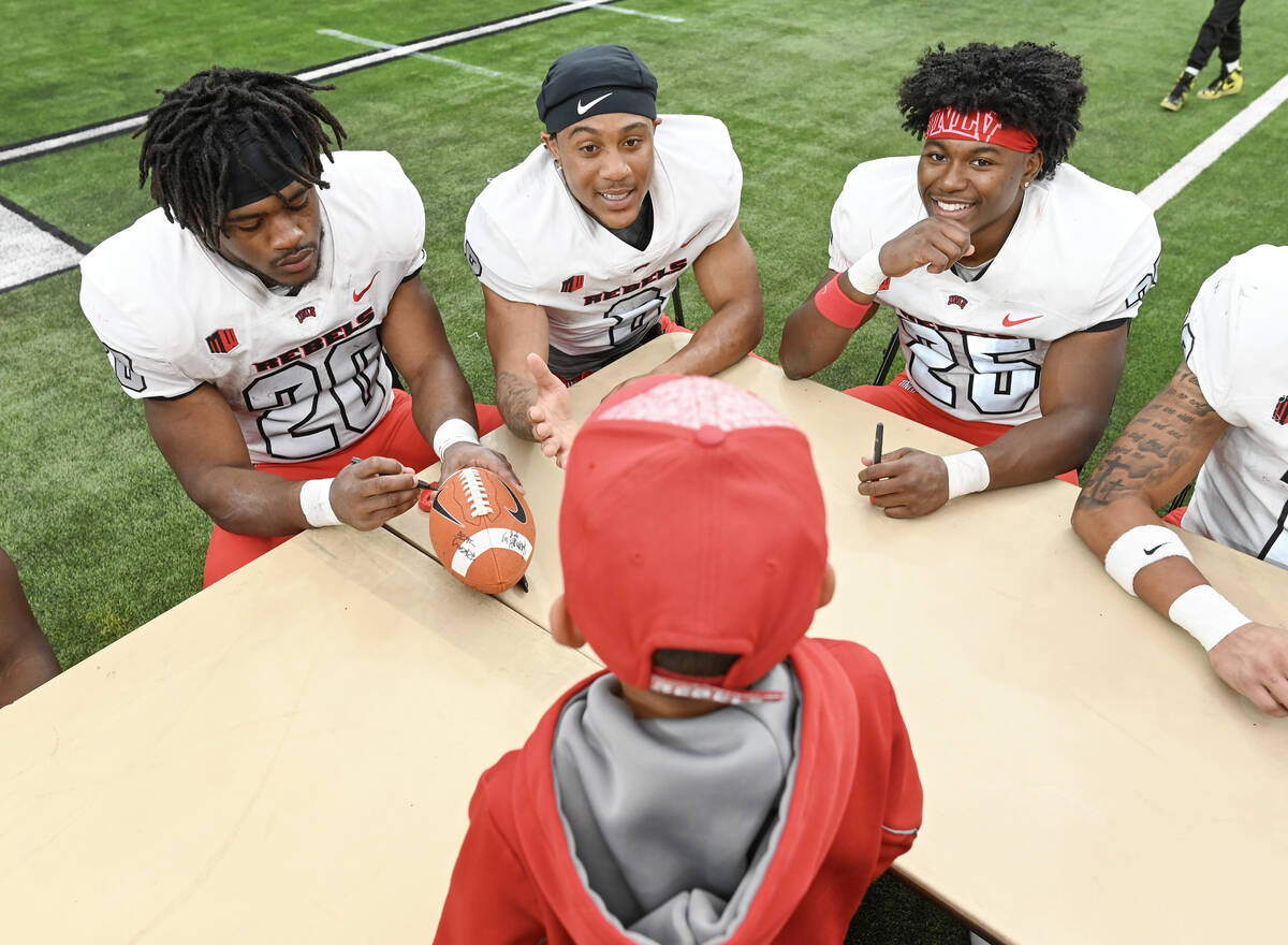 From left, UNLV running back Kylin James, wide receiver Timothy Conerly, and running back Roger ...