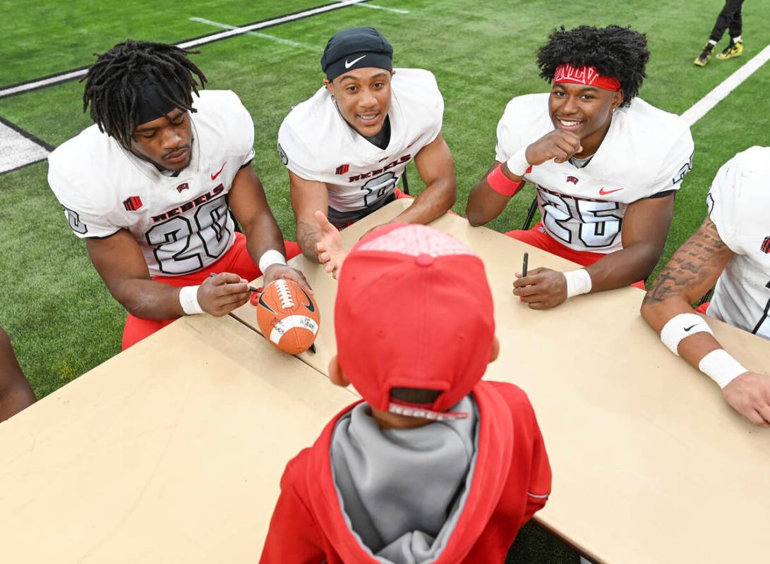 From left, UNLV running back Kylin James, wide receiver Timothy Conerly, and running back Roger ...