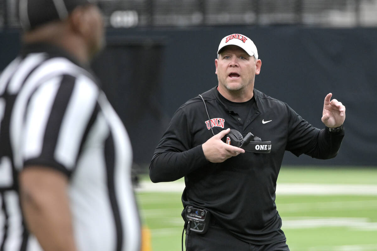 UNLV head coach Barry Odom asks an official a question during UNLV football’s Spring Sho ...