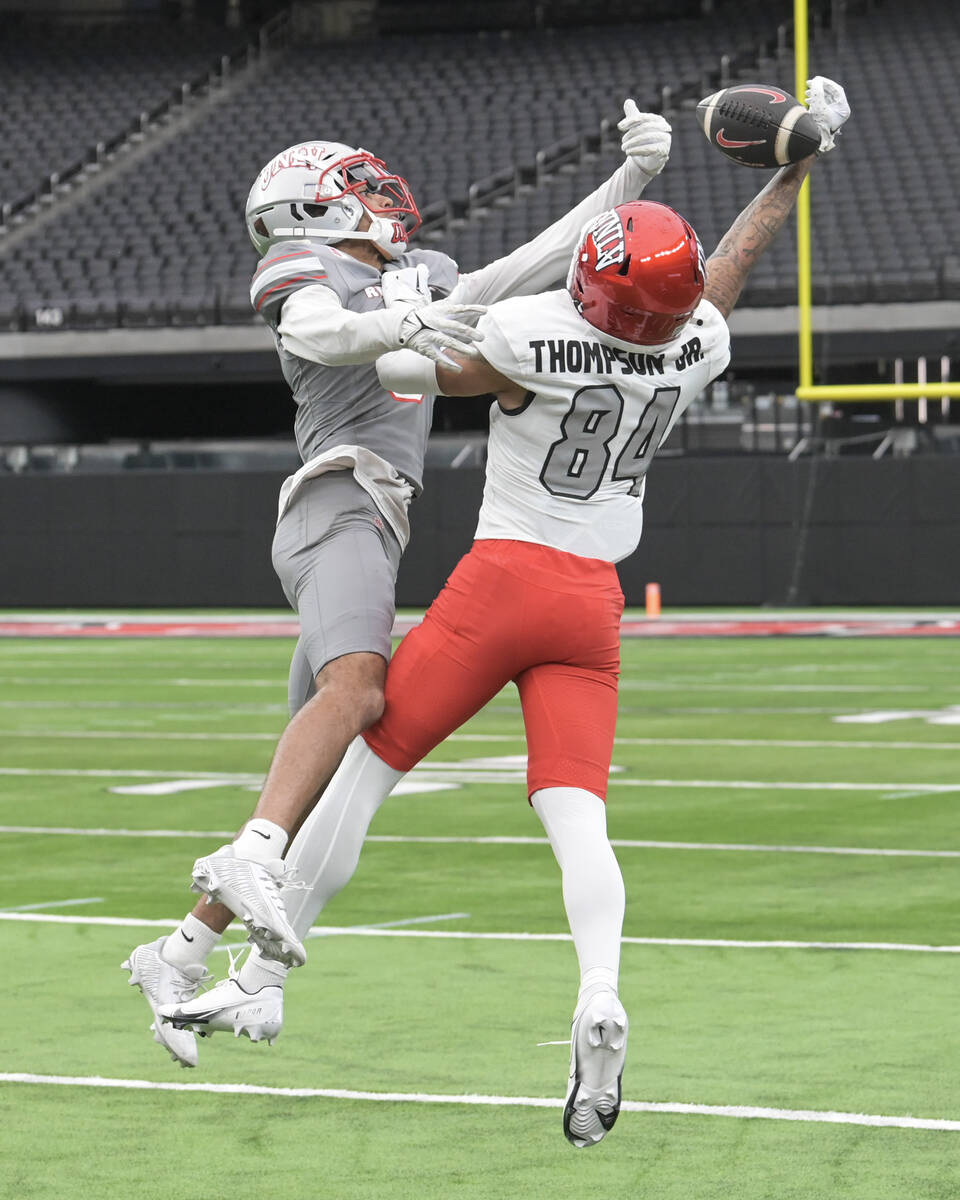 UNLV defensive back Cameron Oliver breaks up a pass intended for wide receiver Corey Thompson J ...
