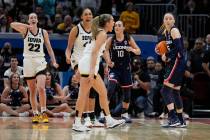Iowa's Gabbie Marshall, center, reacts after UConn's Aaliyah Edwards, not pictured, was called ...