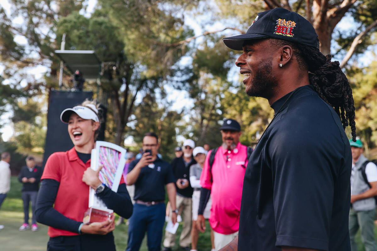 Davante Adams, right, speaks to Nelly Korda during the T-Mobile Match Play championship match a ...