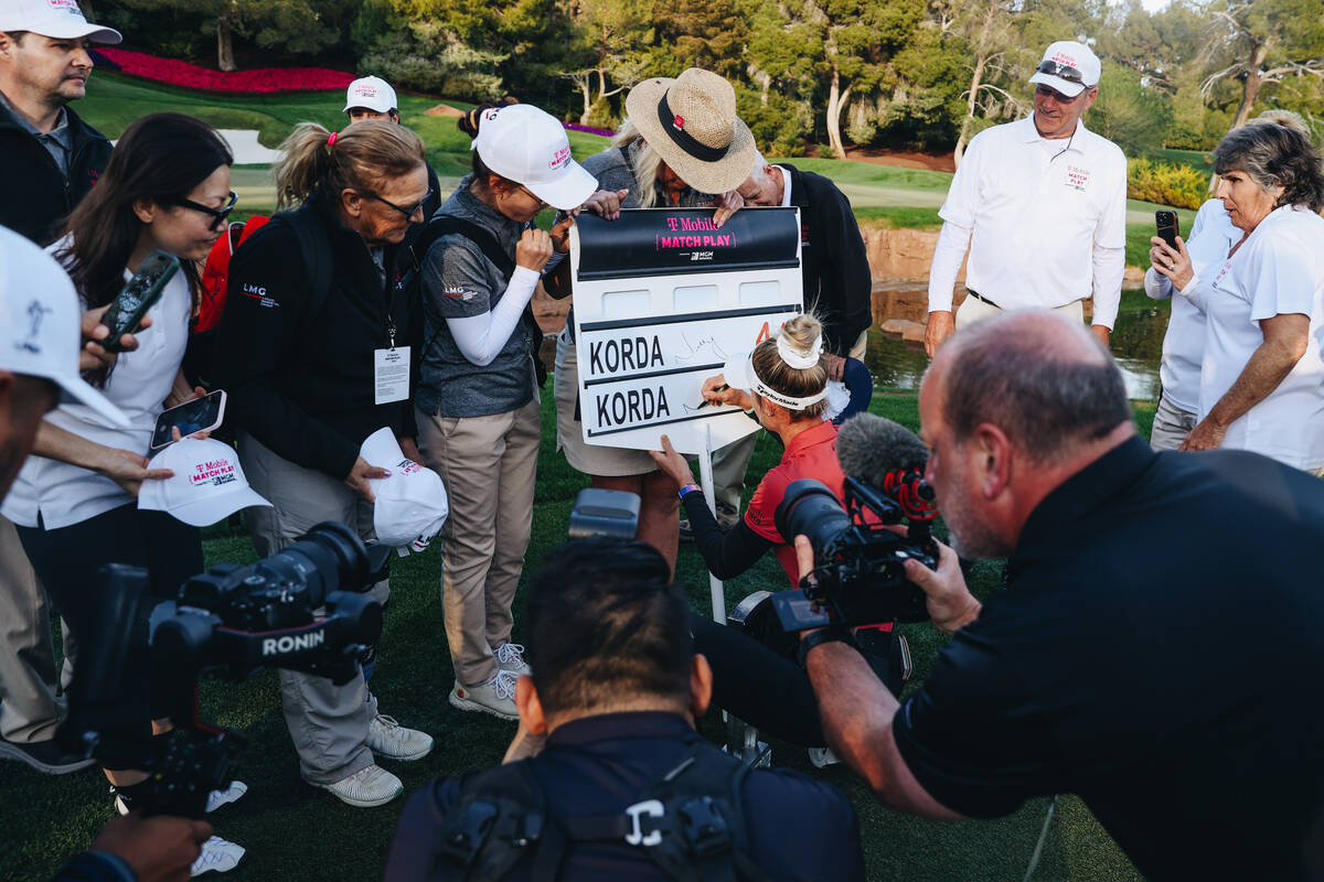 Nelly Korda signs a match sign during the T-Mobile Match Play championship match at Shadow Cree ...