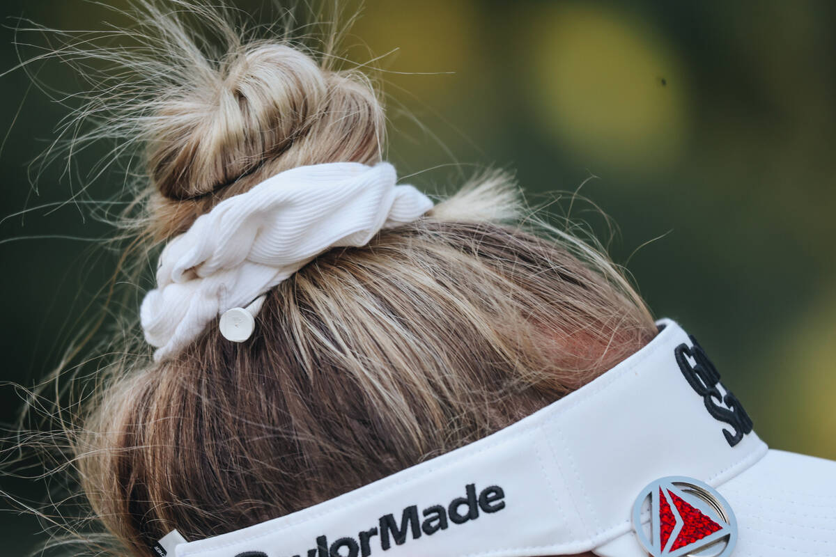 Nelly Korda’s golf tee is seen in her hair during the T-Mobile Match Play championship m ...
