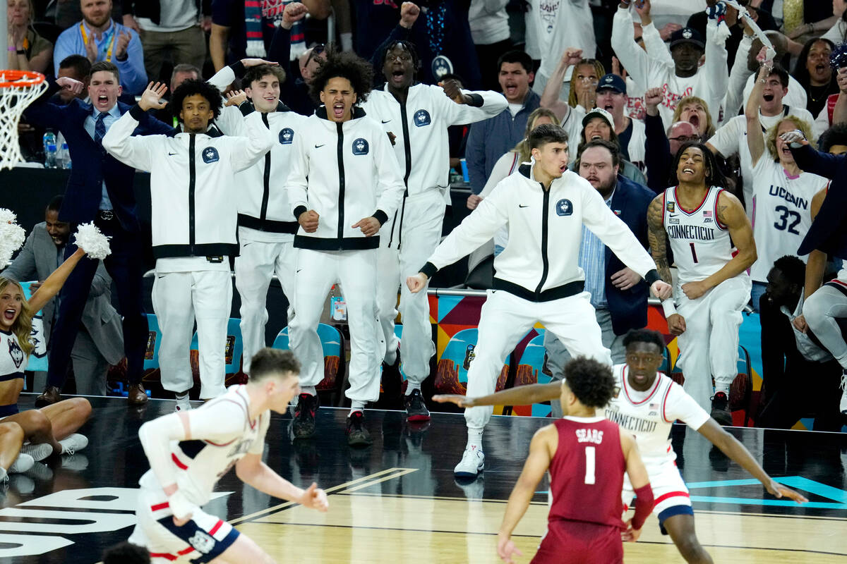 UConn players celebrate during the second half of the NCAA college basketball game against Alab ...