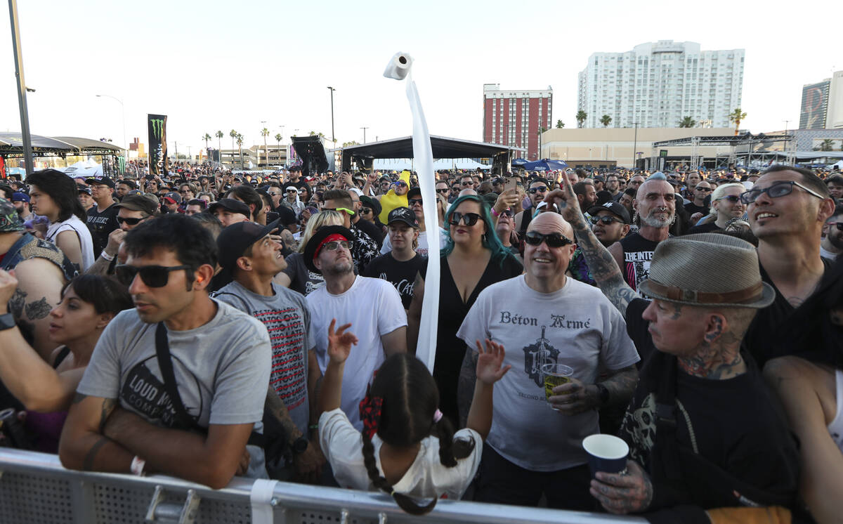 A young fan throws a roll of toilet paper into the crowd as The Slackers perform during the Pun ...