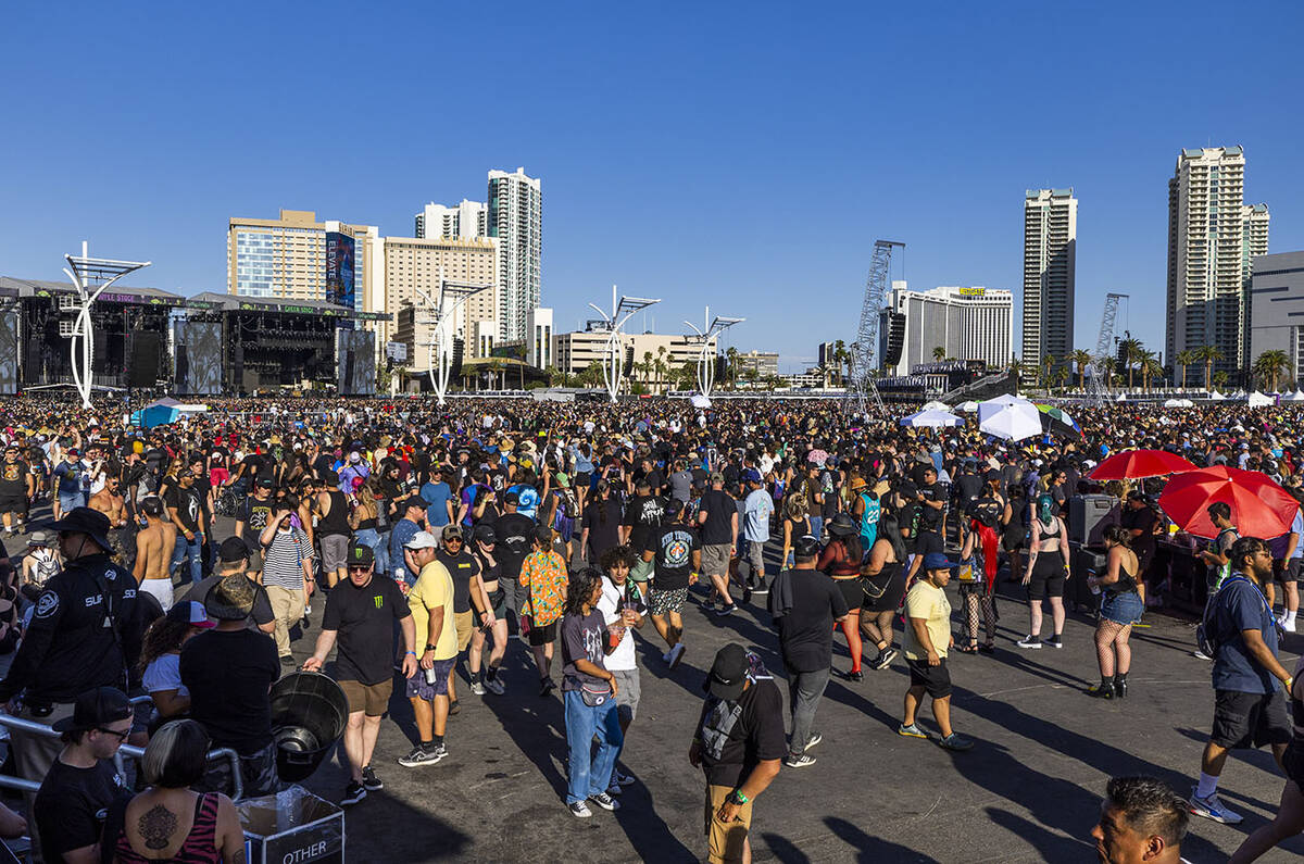 Attendees walk between the four stages during the Sick New World festival at the Las Vegas Fest ...