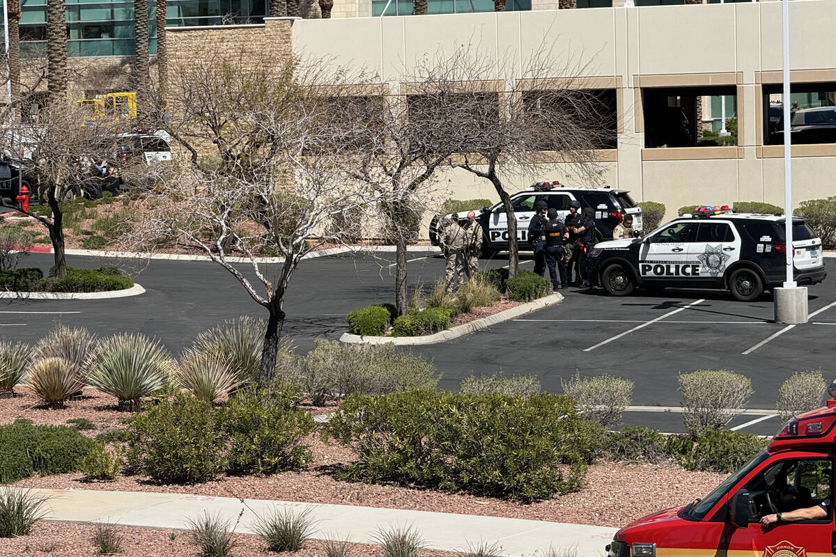 Las Vegas police stage outside a building after a shooting at the Prince Law Group on West Char ...