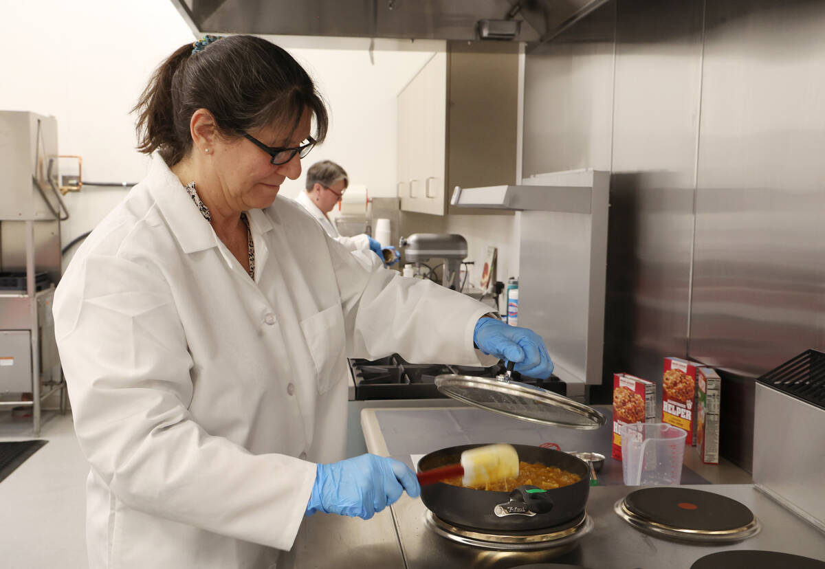 Senior scientist Lisa Humphrey cooks up a batch Hamburger Helper inside of a test kitchen at Ea ...