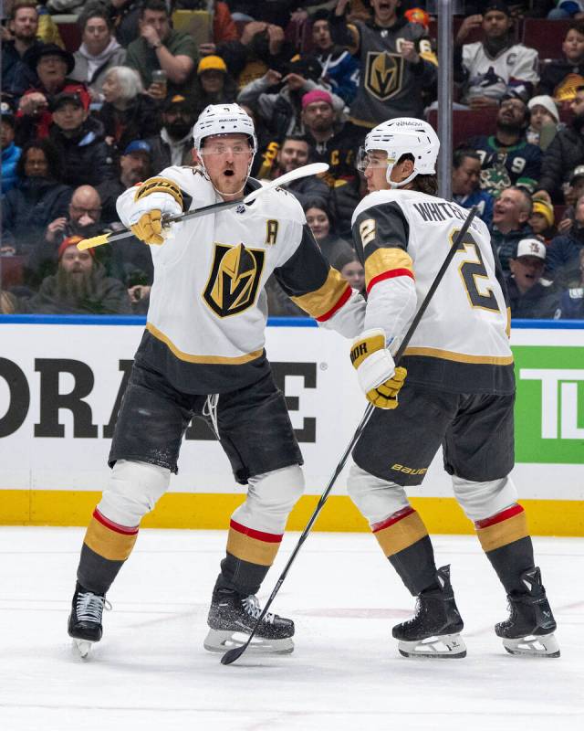 Vegas Golden Knights' Jack Eichel (9) and Zach Whitecloud (2) celebrate after Eichel's goal aga ...