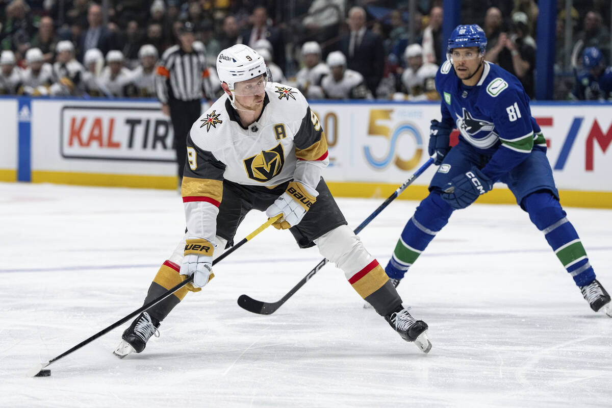 Vegas Golden Knights' Jack Eichel (9) prepares to shoot as Vancouver Canucks' Dakota Joshua (81 ...