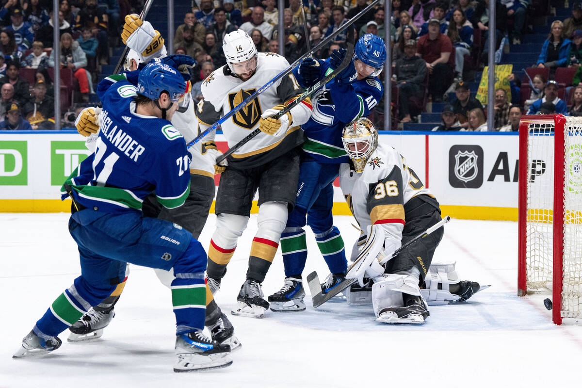 Vancouver Canucks' Brock Boeser, (not shown) scores against Vegas Golden Knights goaltender Log ...