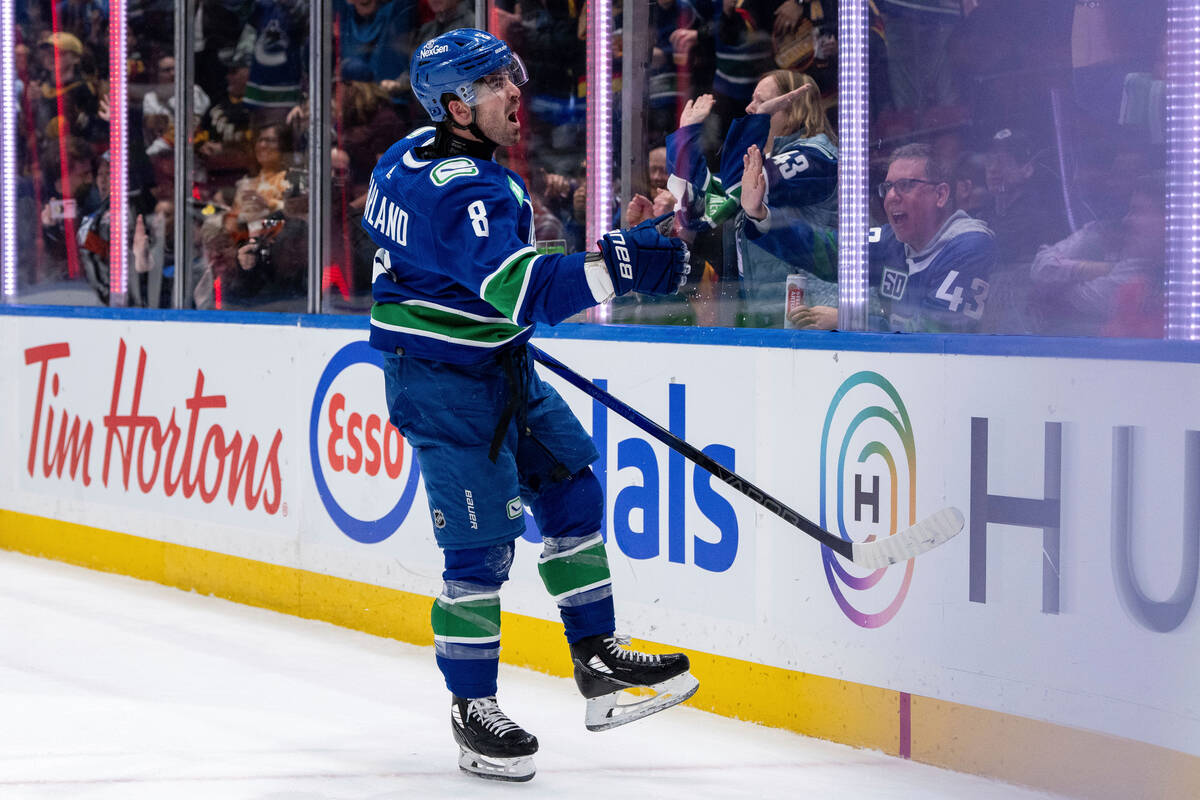 Vancouver Canucks' Conor Garland (8) celebrates after scoring against the Vegas Golden Knights ...