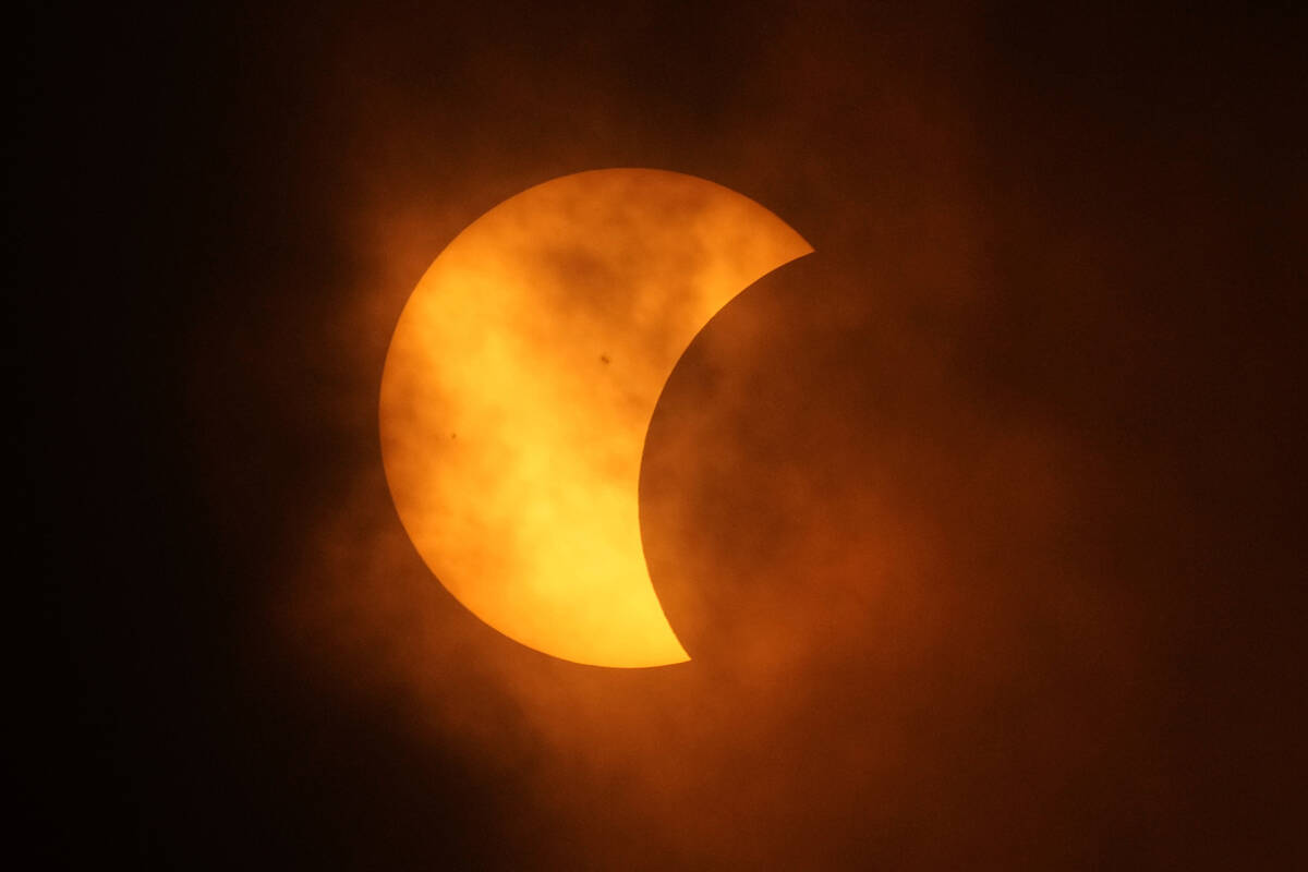 The moon partially covers the sun during a total solar eclipse, as seen from Eagle Pass, Texas, ...
