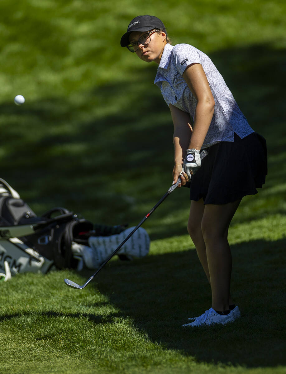 McKenzi Hall of UNLV chips the ball from the 13th rough onto the green during the first day of ...