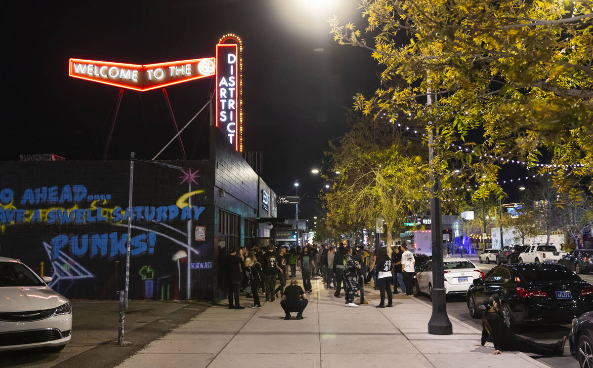 Attendees stand outside during a break at a concert at the newly-opened venue Sinwave on Monday ...