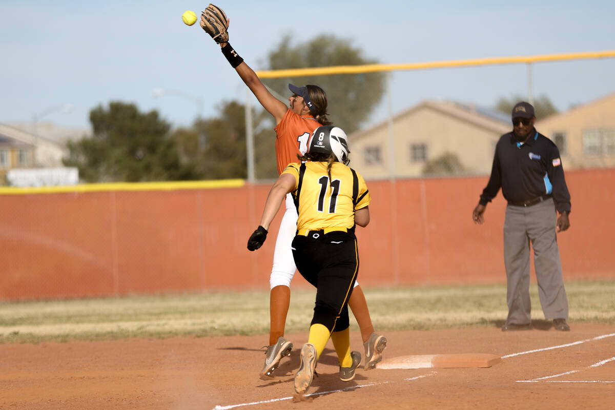 Legacy first baseman Madison Castellon reaches to catch for an out on Clark’s Paola Garc ...