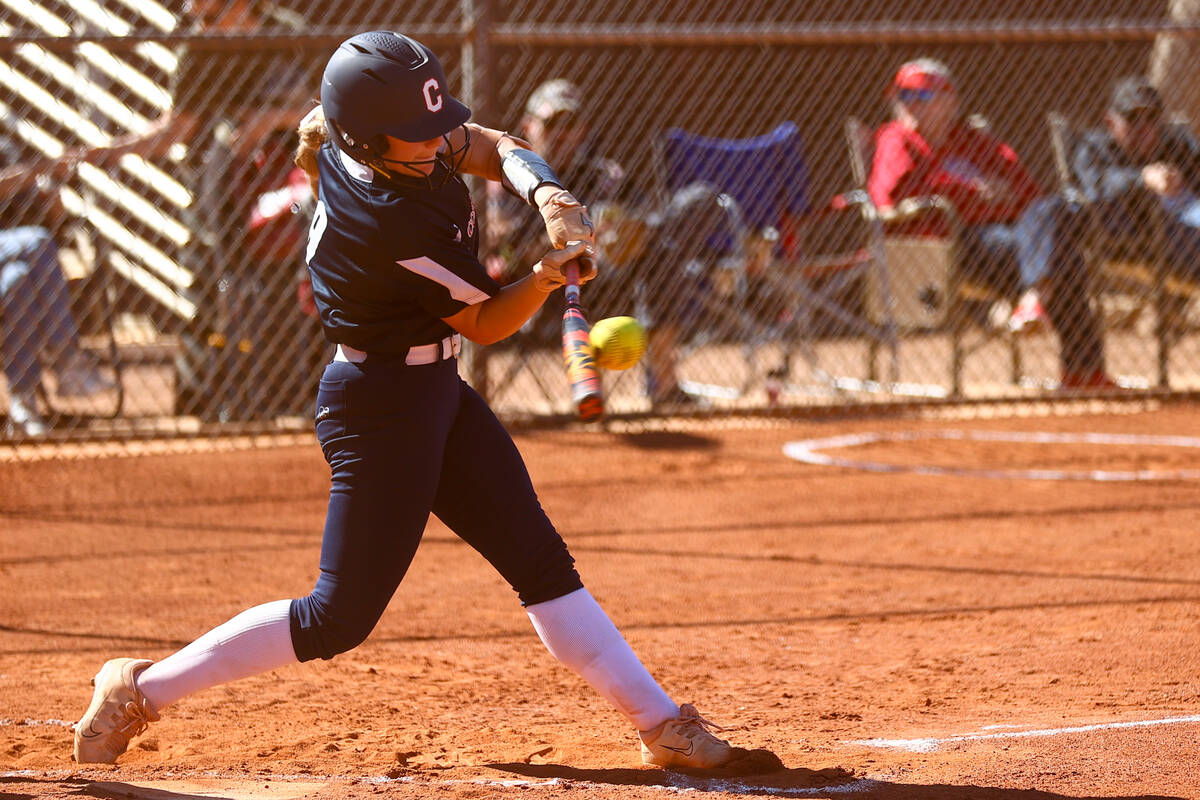 Coronado's Kendall Selitzky (9) gets a hit on Liberty during a high school softball game on Tue ...