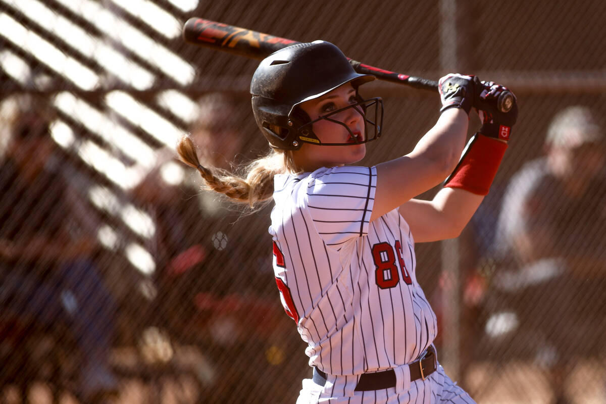 Liberty's Morgyn Vesco (86) takes off after getting a hit on Coronado during a high school soft ...