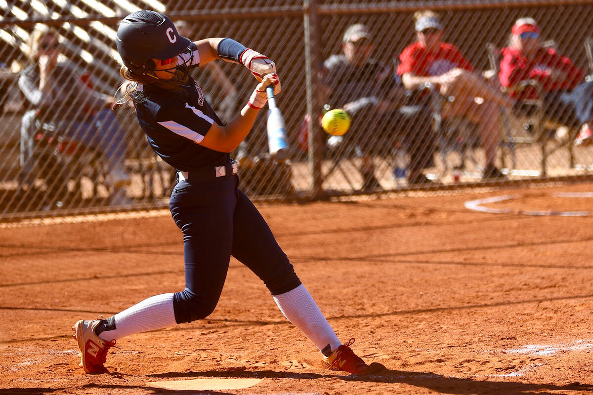 Coronado's Bailey Goldberg (1) gets a hit on Liberty during a high school softball game on Tues ...