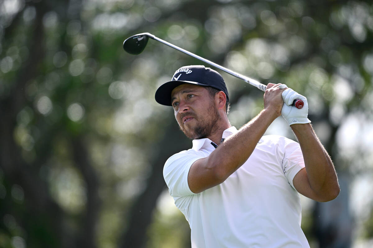 Xander Schauffele watches his tee shot on the 11th hole during the first round of the Arnold Pa ...