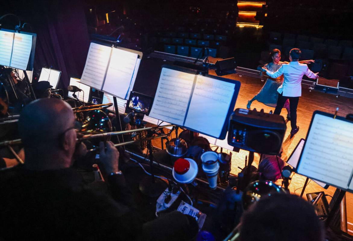 Cynthia Nesbit and Seth Sikes dance as the 30 piece orchestra performs during dress rehearsal f ...