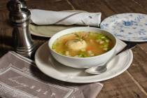 Matzo ball soup with braised chicken is one of the specials being served for Passover 2024 at H ...