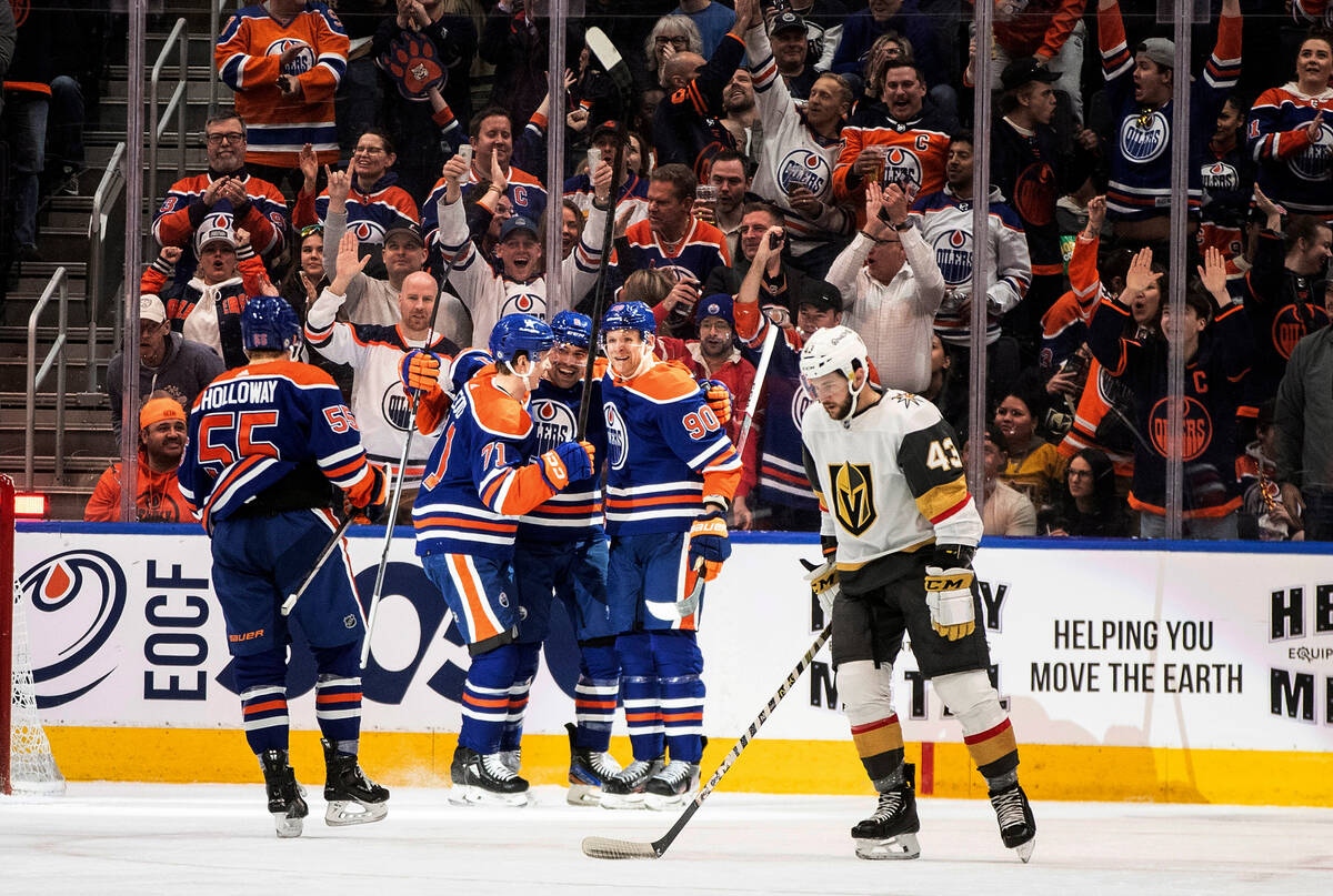 Vegas Golden Knights' Paul Cotter (43) skates past as the Edmonton Oilers celebrate a goal duri ...