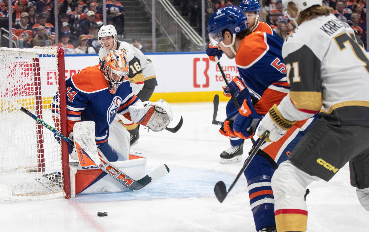 Vegas Golden Knights' Pavel Dorofeyev (16) is stopped by Edmonton Oilers goalie Stuart Skinner ...