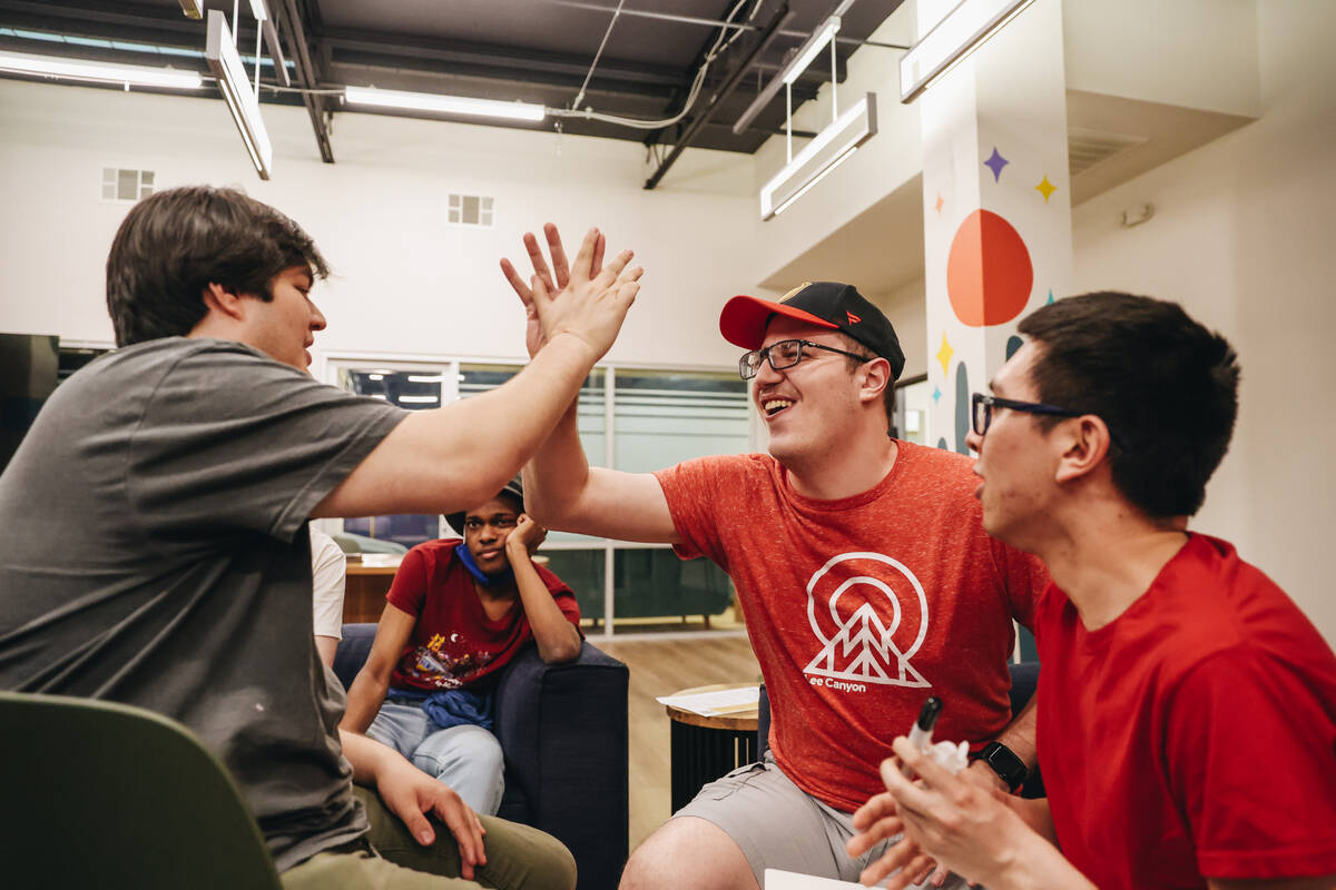 A social group partakes in a group activity at Inclusion Fusion on Friday, April 19, 2024, in H ...