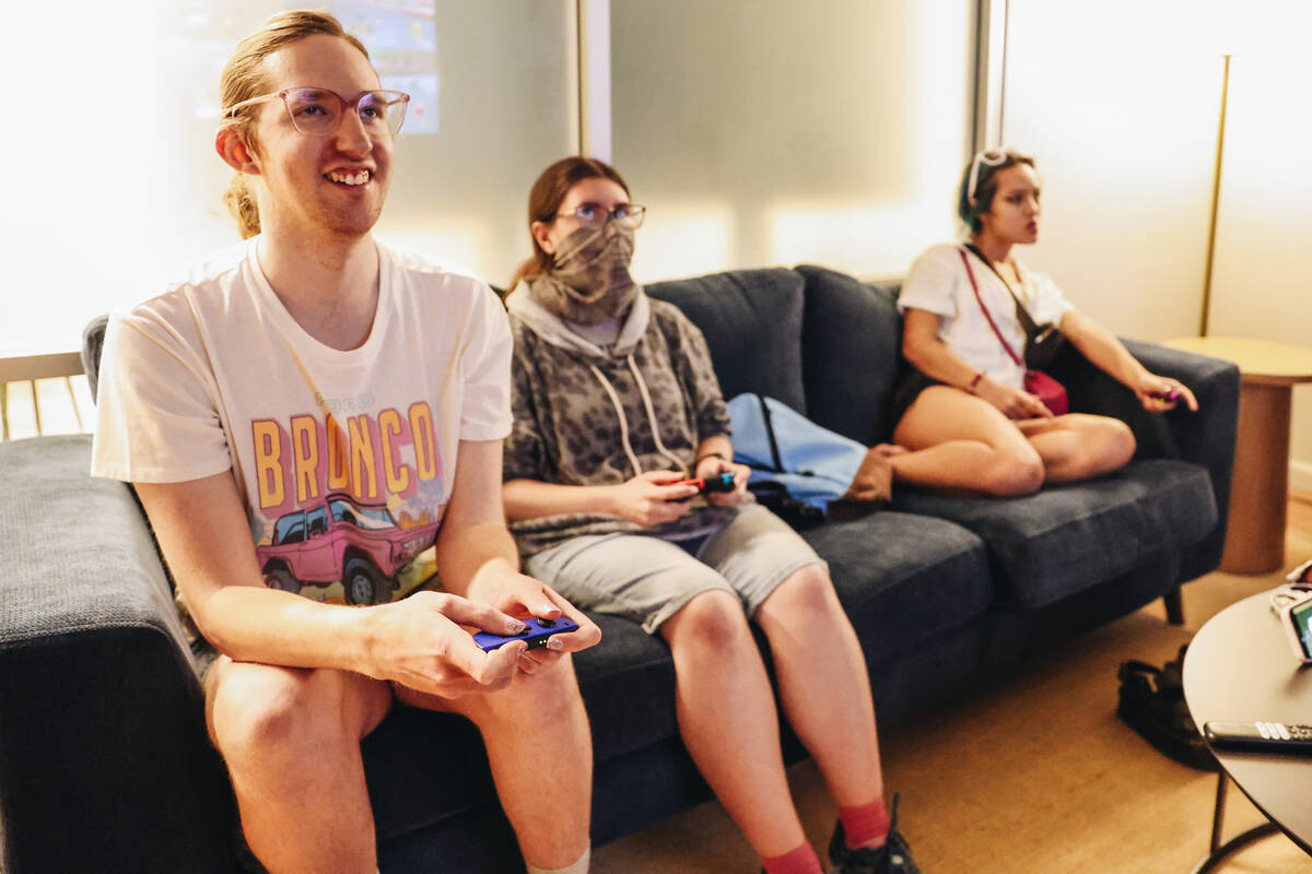 A social group partakes in a group session of Mario Kart at Inclusion Fusion on Friday, April 1 ...